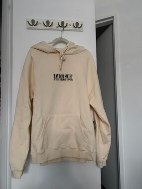 Taylor Swift Cream Pullover Hoodie - The Eras Tour Logo